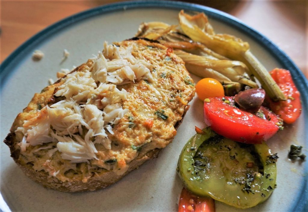 Crab rarebit on sourdough with mixed tomato salad and roasted fennel