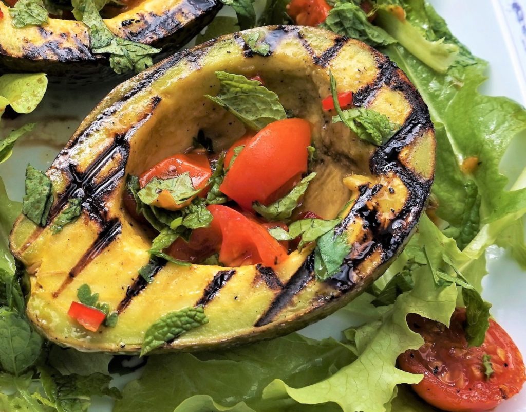 griddled avocado with roasted tomatoes on chilli, coriander, mint salad