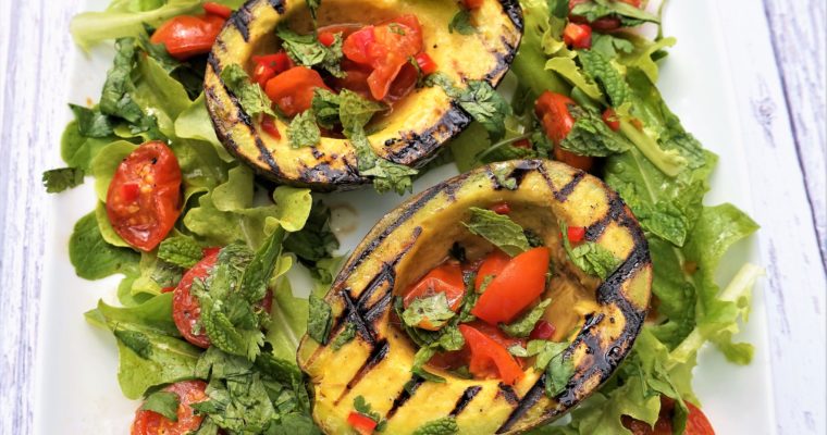 Griddled avocado with balsamic-roasted tomatoes, chilli, coriander & mint salad.