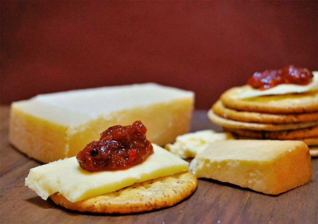 Smoky tomato chilli chutney with cheese and crackers Smoky tomato chilli chutney with cheese and crackers