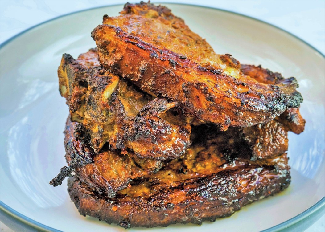 A plate of roasted harissa lamb chops