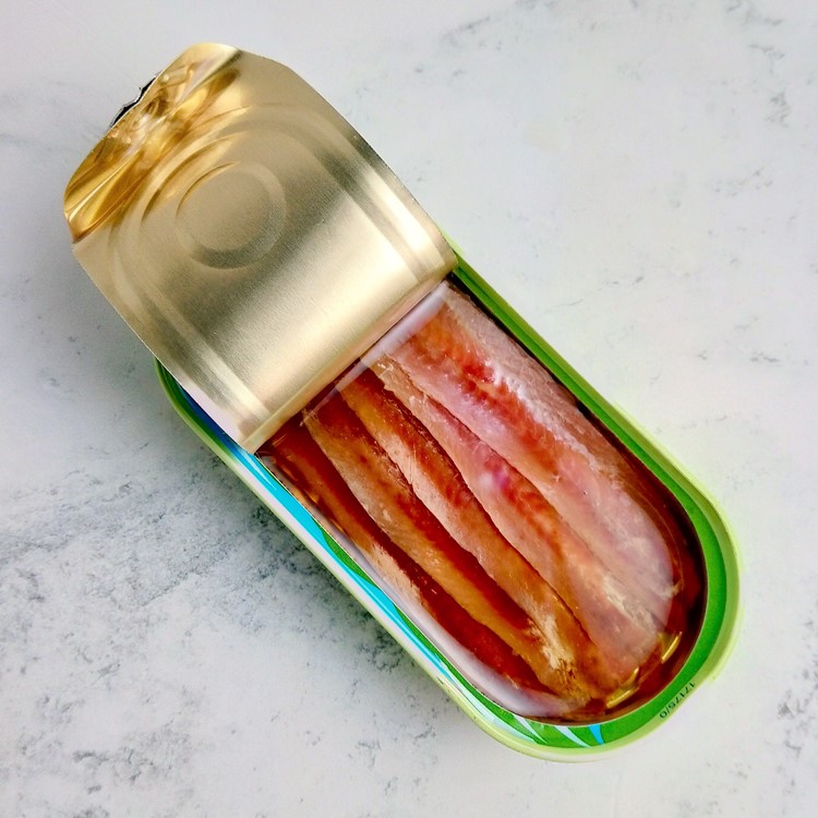 an open tin of anchovies