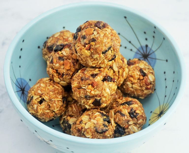 a bowl of almond and raisin oat bites