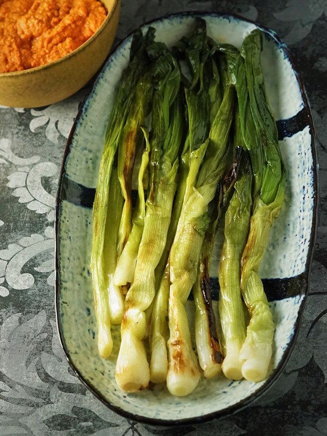 grilled spring onions with romesco sauce