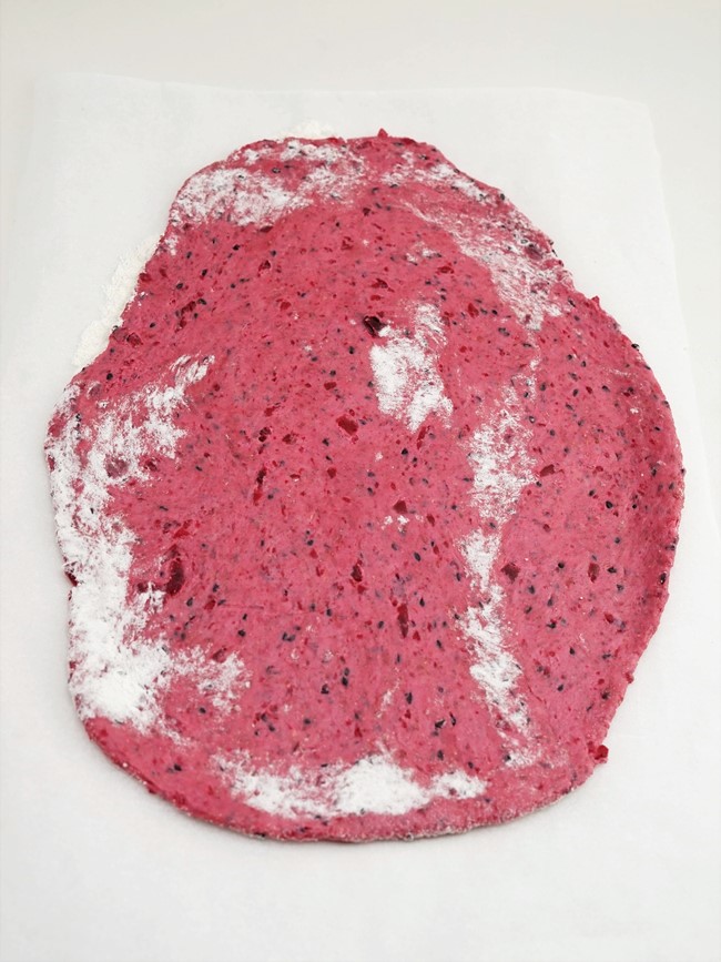 rolling the dough for beetroot crackers