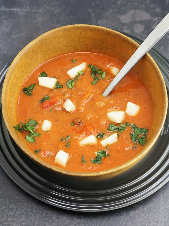Spicy Carlin Pea Soup with roasted peppers and sheep cheese