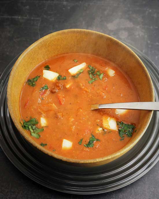 Spicy Carlin Pea Soup with roasted peppers and sheep cheese