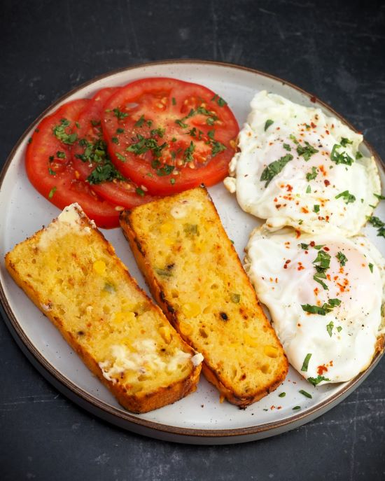 toasted Cheese & Chilli Cornbread with fried eggs and tomatoes