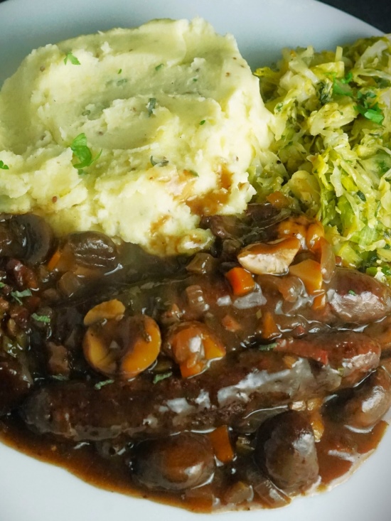 Venison Sausage Casserole with mustard mash and green vegetables