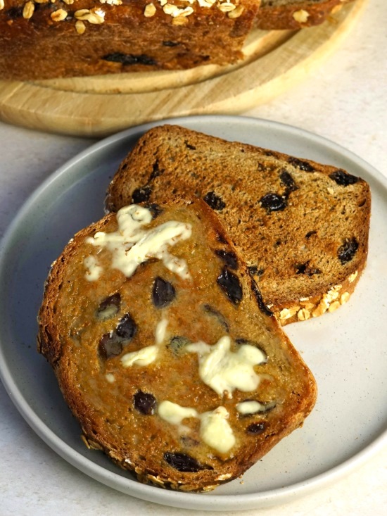 Toasted and buttered Cinnamon Raisin Oat Bread