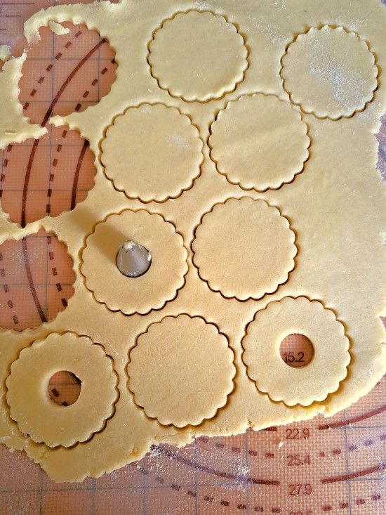 cutting out dough for Jam and Cream Biscuits