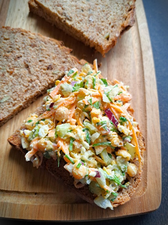 making Chickpea Feta Salad Sandwich