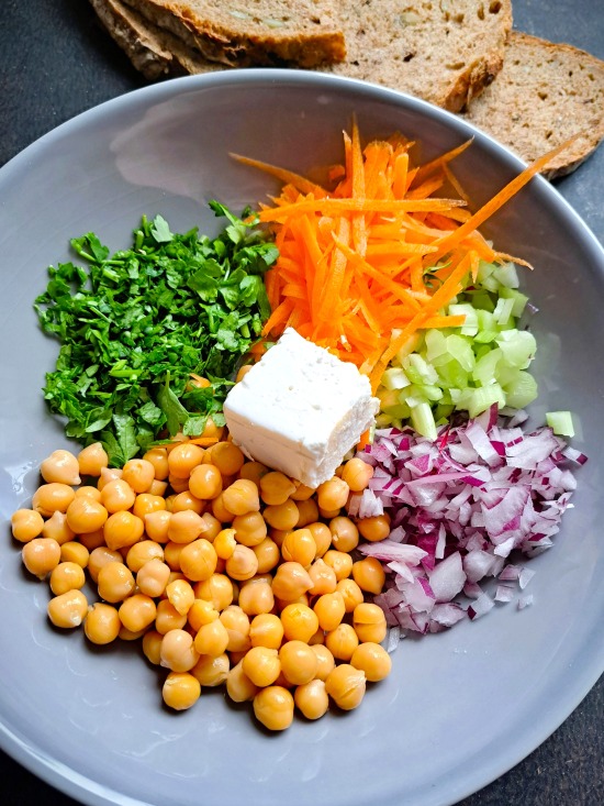 making Chickpea Feta Salad Sandwich