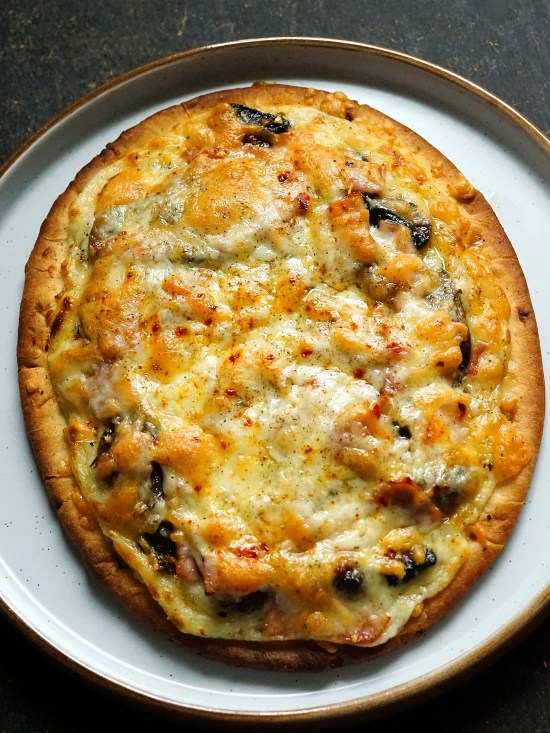 White Flatbread Pizza with Ham and Mushrooms