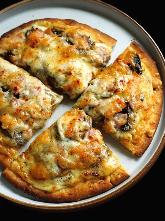 White Flatbread Pizza with Ham and Mushrooms