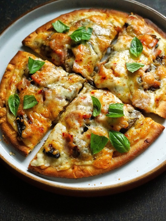 White Flatbread Pizza with Ham and Mushrooms