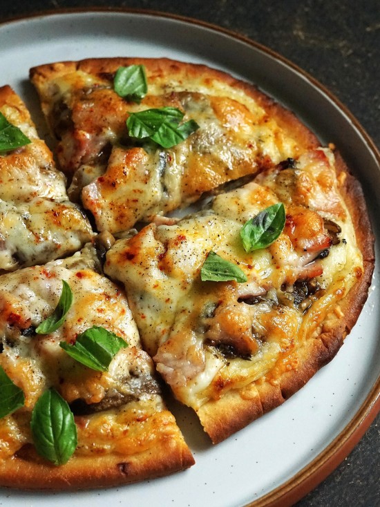 White Flatbread Pizza with Ham and Mushrooms