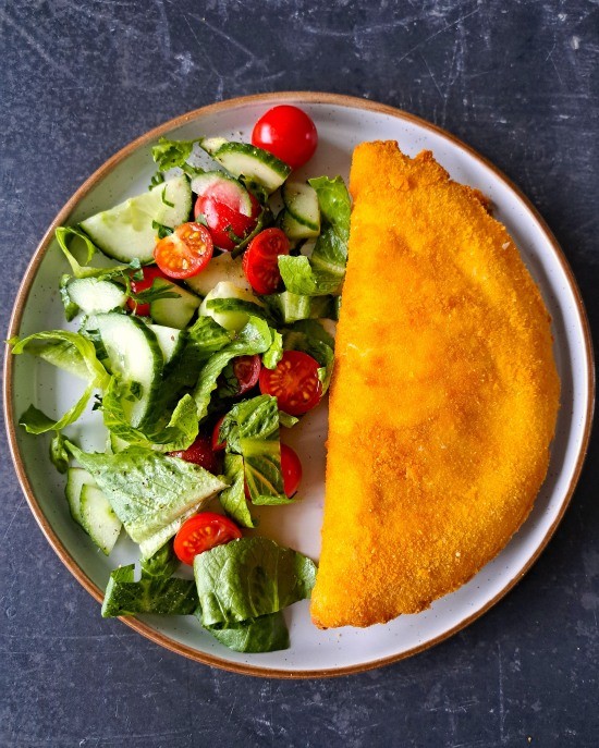 large homemade Chicken and Bacon Crispy Pancake served with salad