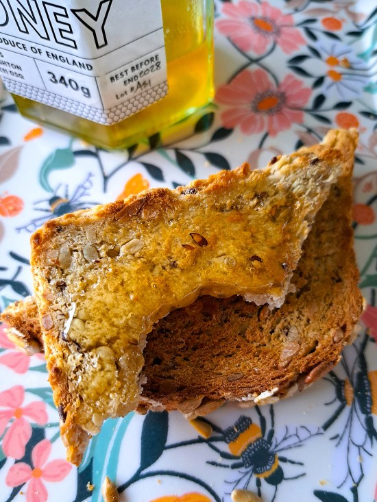 toasted Sunflower, Honey and Oat Bread with butter and honey