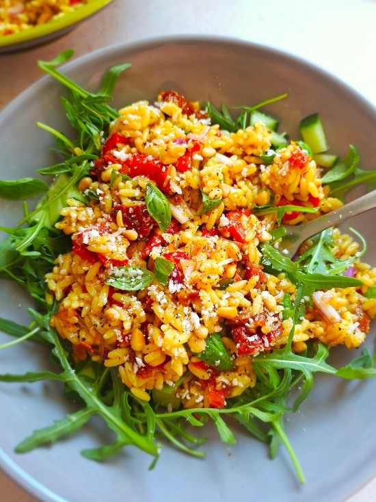 Sun-Dried Tomato Orzo Salad served on rocket