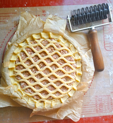 assembled Sausage & Onion Lattice Pie with lattice pastry cutter