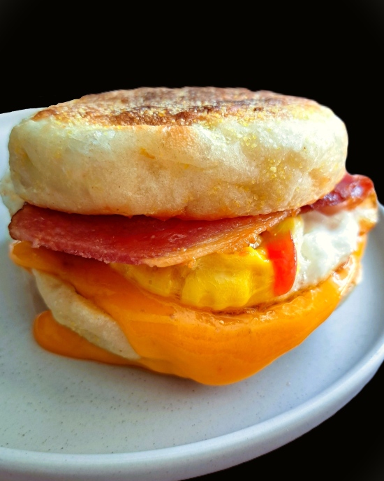 homemade English Muffin with cheese, egg, bacon