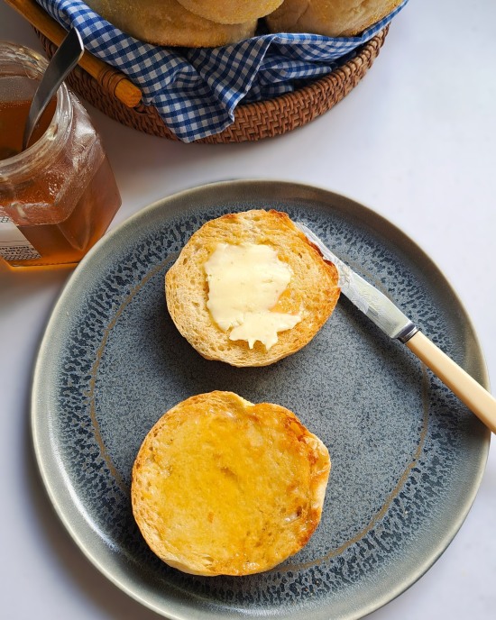 English Muffins toasted with butter and honey