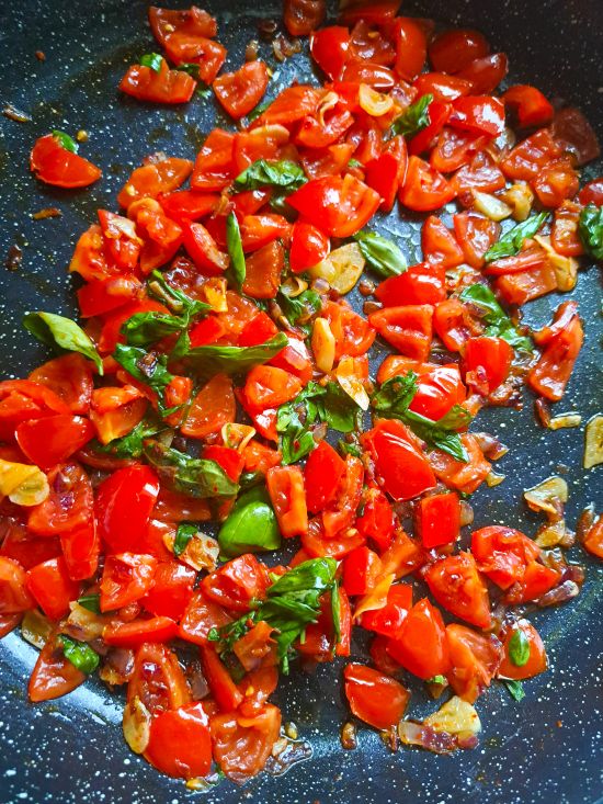 making fresh tomato and basil topping for soup making fresh tomato and basil topping for soup