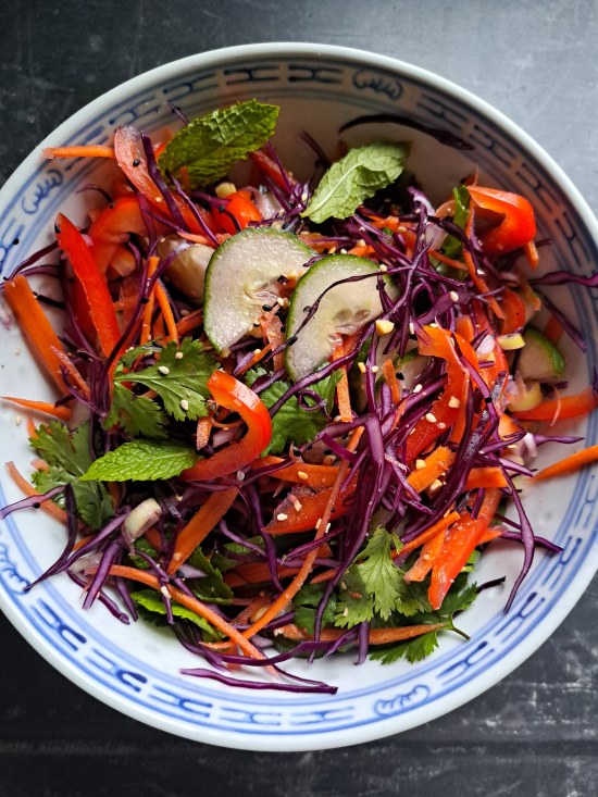 tossed vegetables, nuts and seeds for for Crispy Dumpling Salad